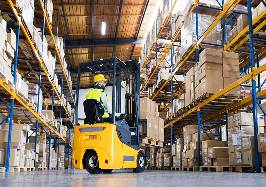 Warehouse man worker with forklift